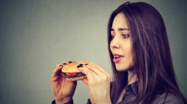 A woman eating junk food