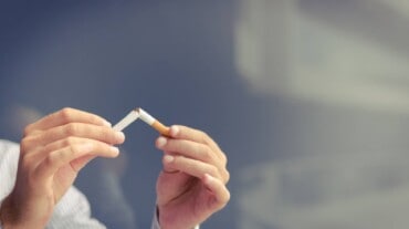 A man breaking cigarette