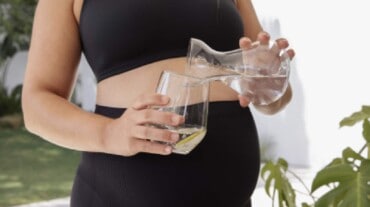 A woman having healthy drink during summer pregnancy