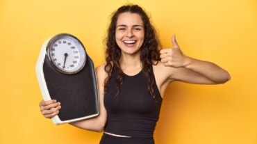 Woman with a weighing scale